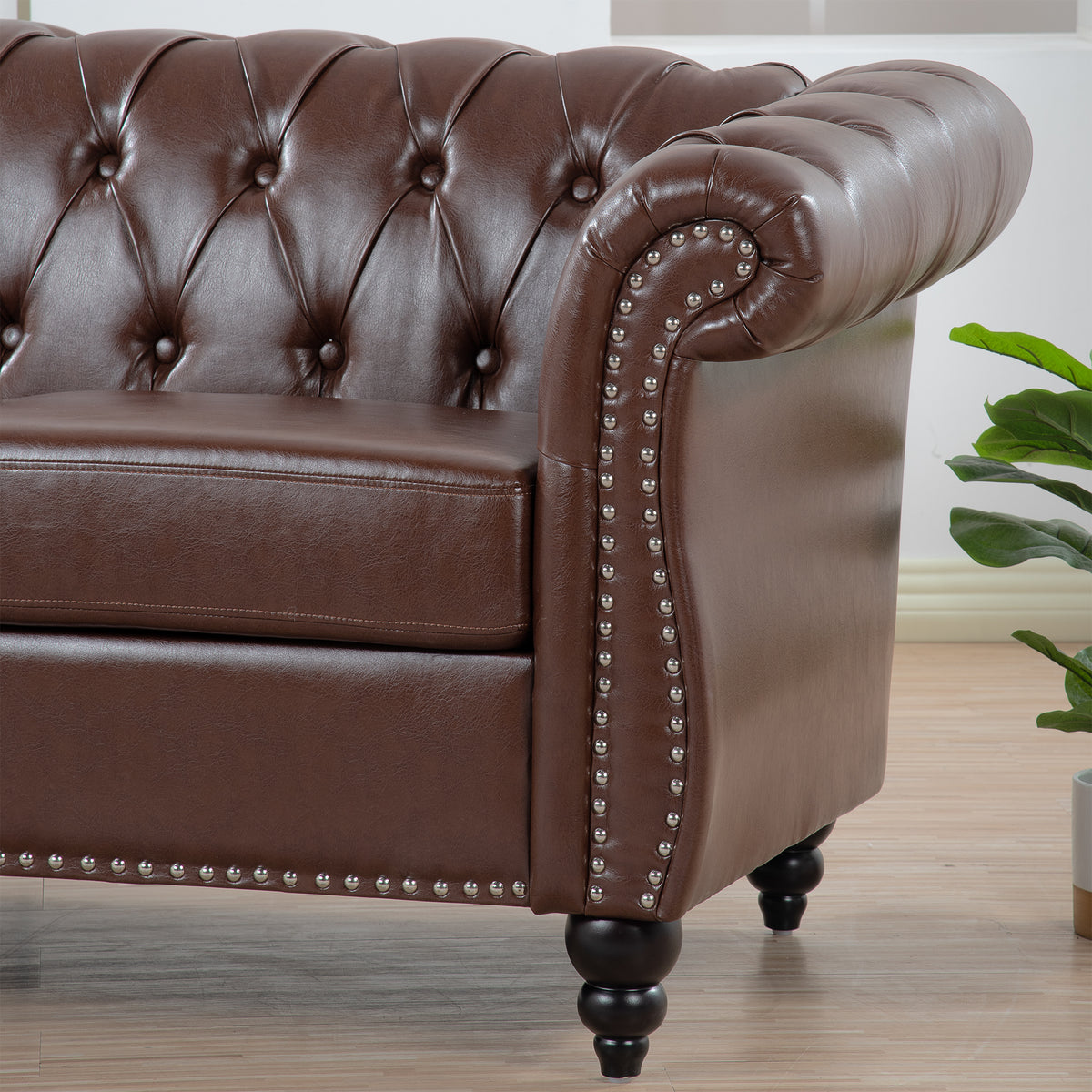 Anthony & Home Chesterfield sofa with birch wood legs, showcasing plush upholstery and classic design in a stylish living room setting.