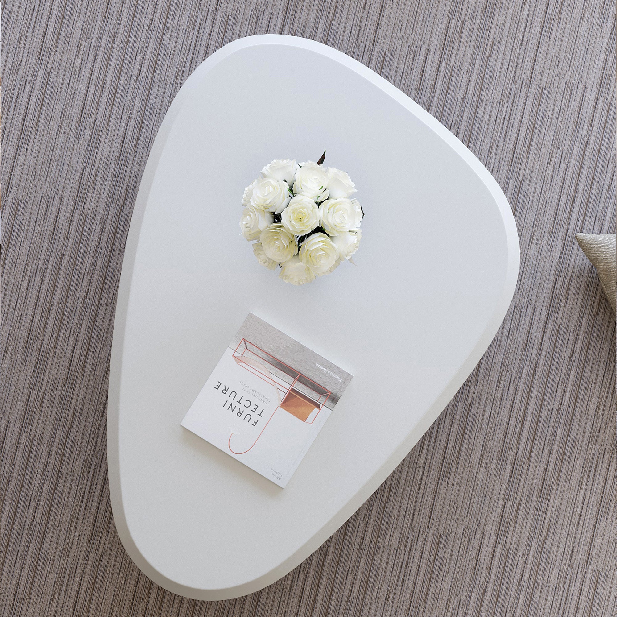 Creamy white lacquered MDF cloud-shaped coffee table with studio teardrop top and three ball legs by Anthony & Home.