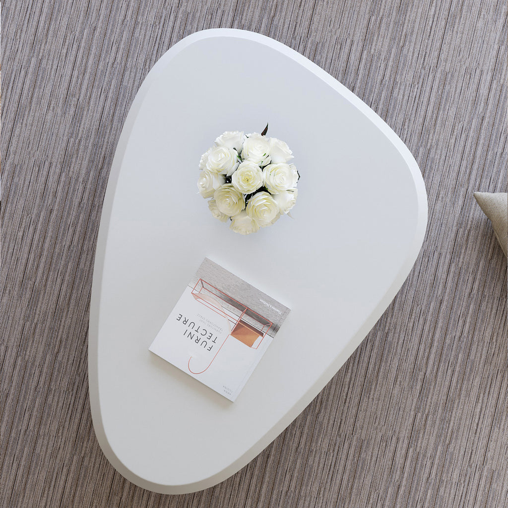 Creamy white lacquered MDF cloud-shaped coffee table with studio teardrop top and three ball legs by Anthony & Home.
