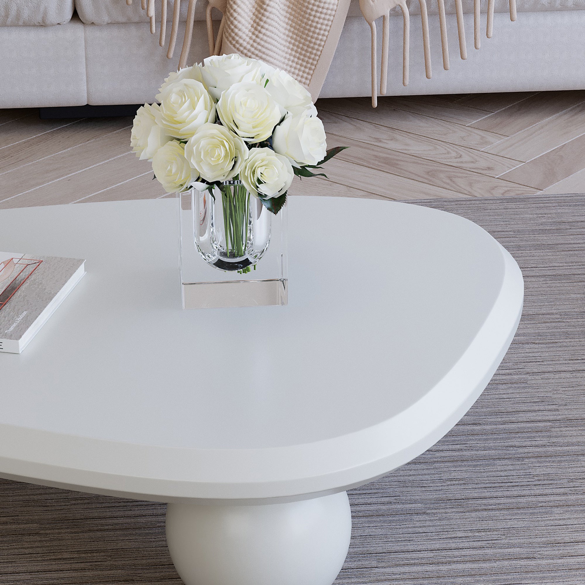 Creamy white lacquered MDF coffee table with studio teardrop top and three ball legs by Anthony & Home