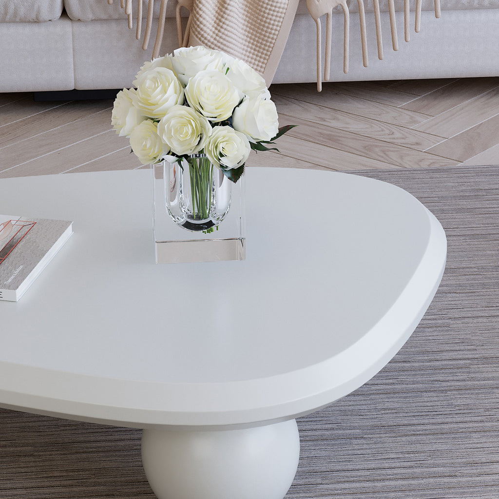 Creamy white lacquered MDF coffee table with studio teardrop top and three ball legs by Anthony & Home