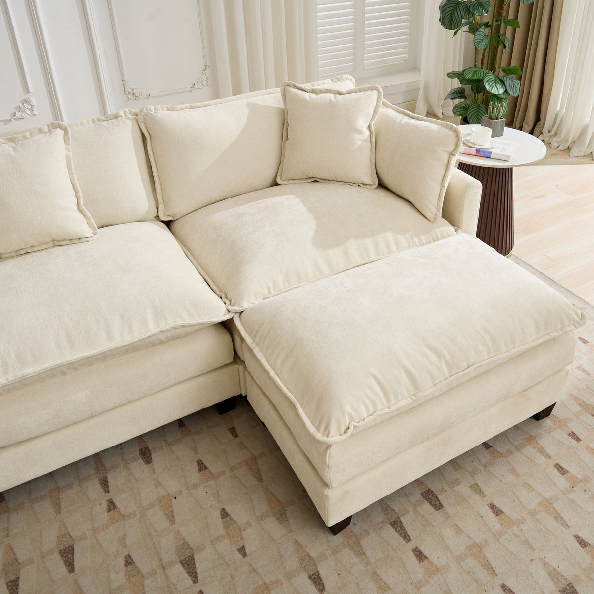 Beige chenille sectional sofa from Cloud Studio by Anthony & Home, featuring plush cushions and modern design.