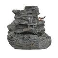 Concrete rock waterfall fountain with four tiers, featuring natural stone design and flowing water for outdoor garden decor.