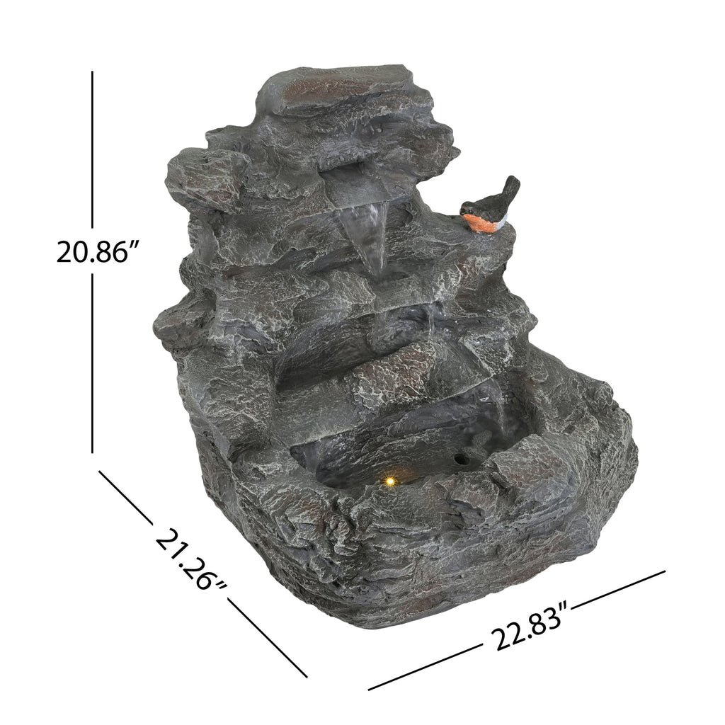 Concrete rock waterfall fountain with four-tier design by Anthony & Home, featuring natural stone appearance and flowing water.