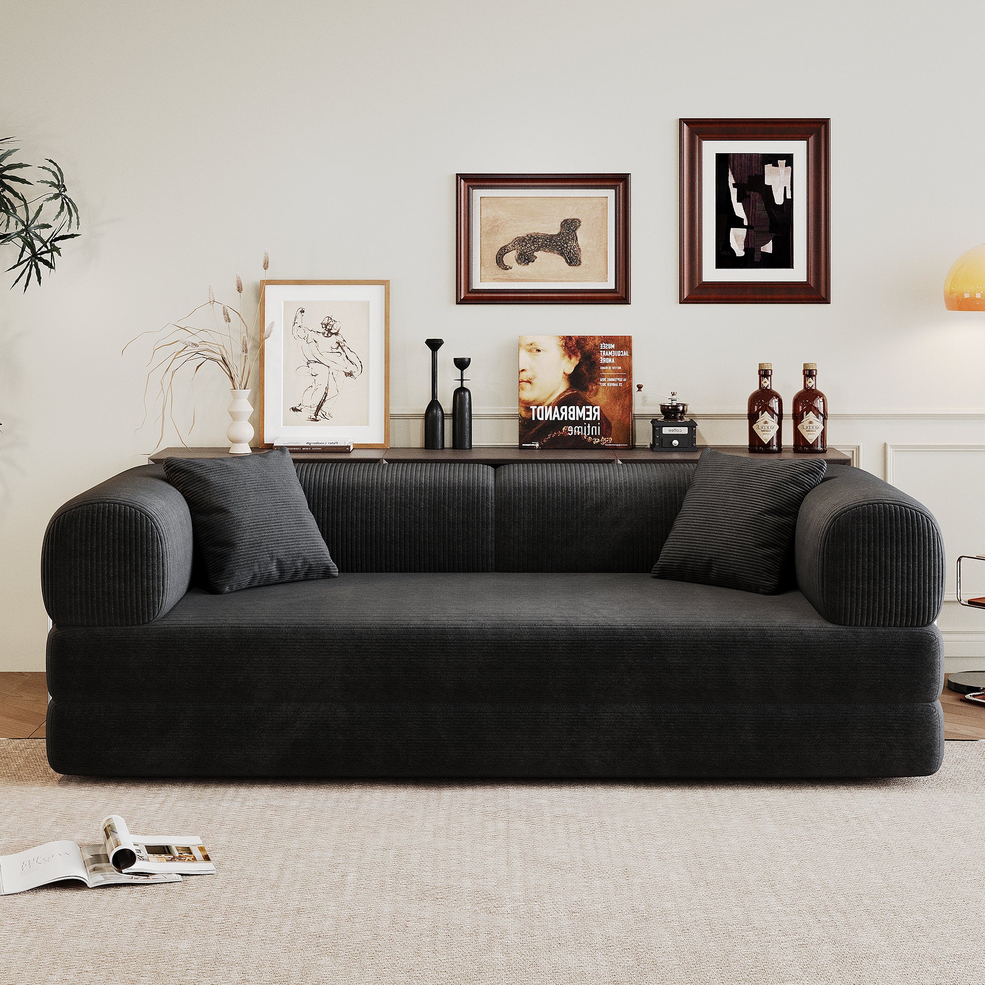 Black Anthony & Home Corduroy Convertible Sofa Bed from the Atelier Collection, showing its plush fabric and convertible design