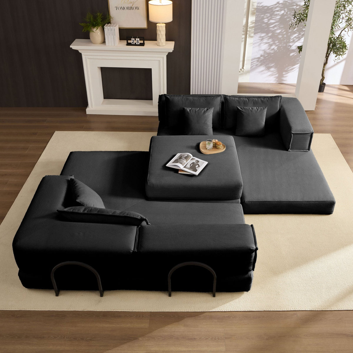 Black corduroy modular sectional sofa by Anthony & Home, showcasing its sleek fabric and versatile design in a modern living space.