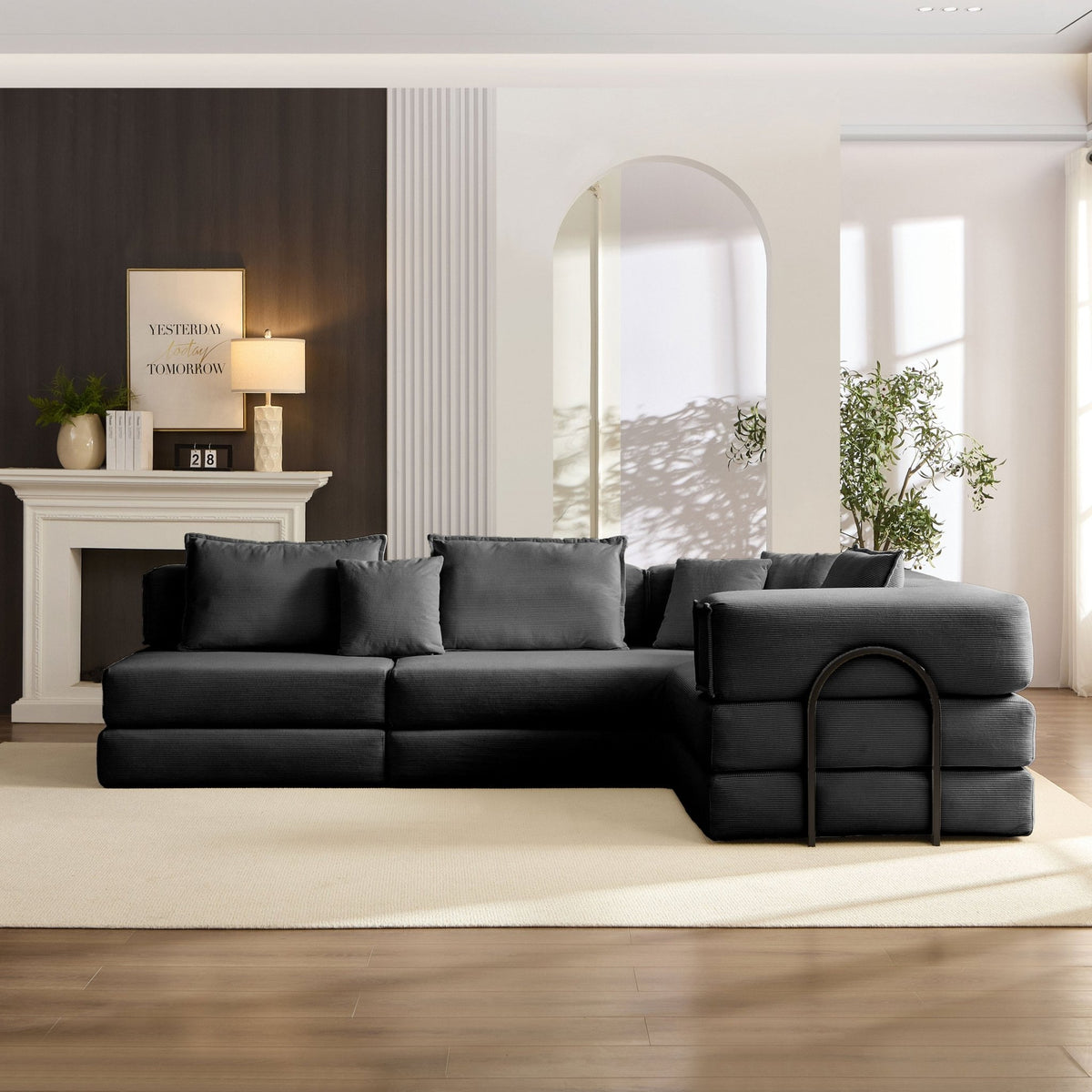 Black corduroy modular sectional sofa by Anthony & Home, showcasing its plush fabric and modern design.