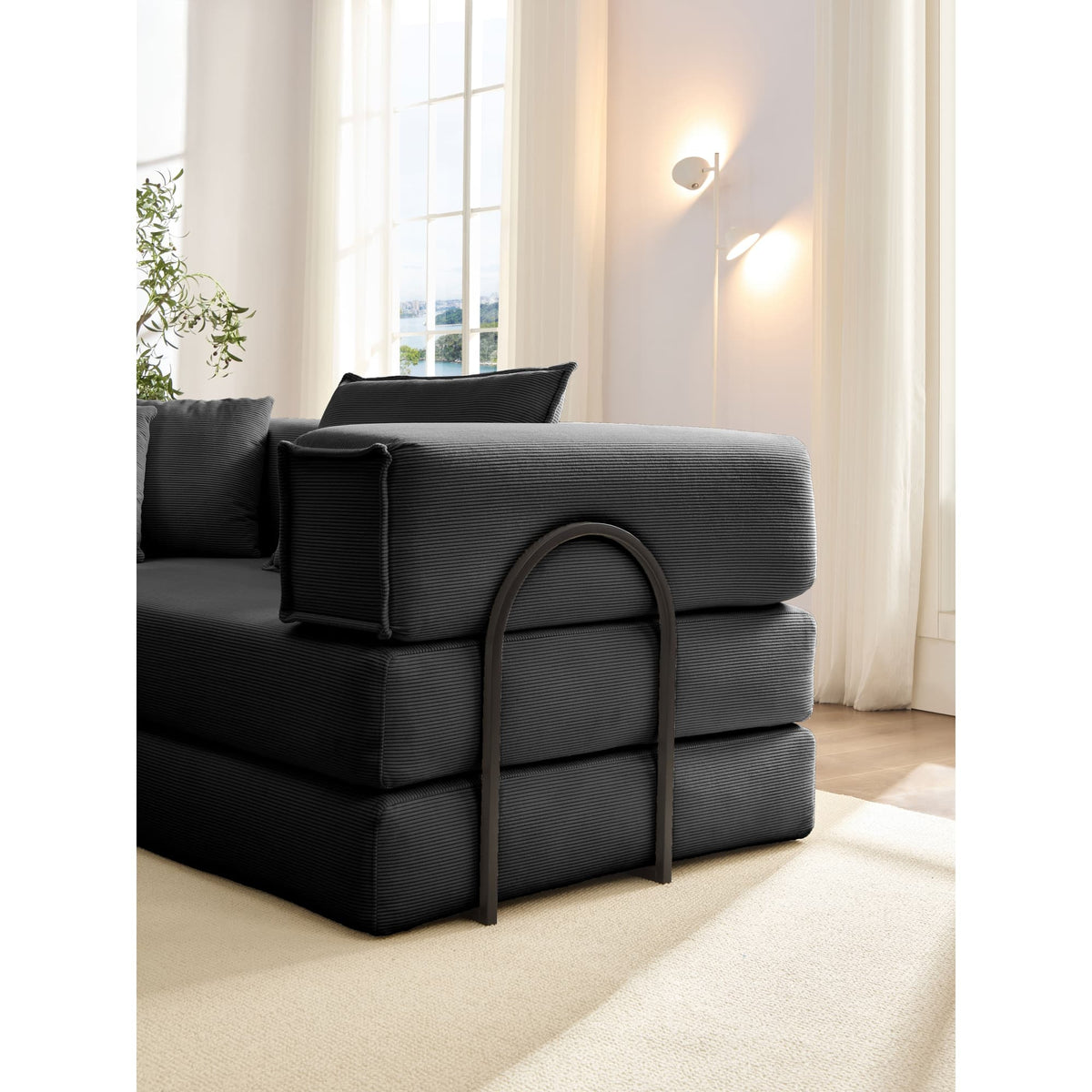 Black corduroy modular sectional sofa by Anthony & Home, showcasing its stylish fabric and versatile design.