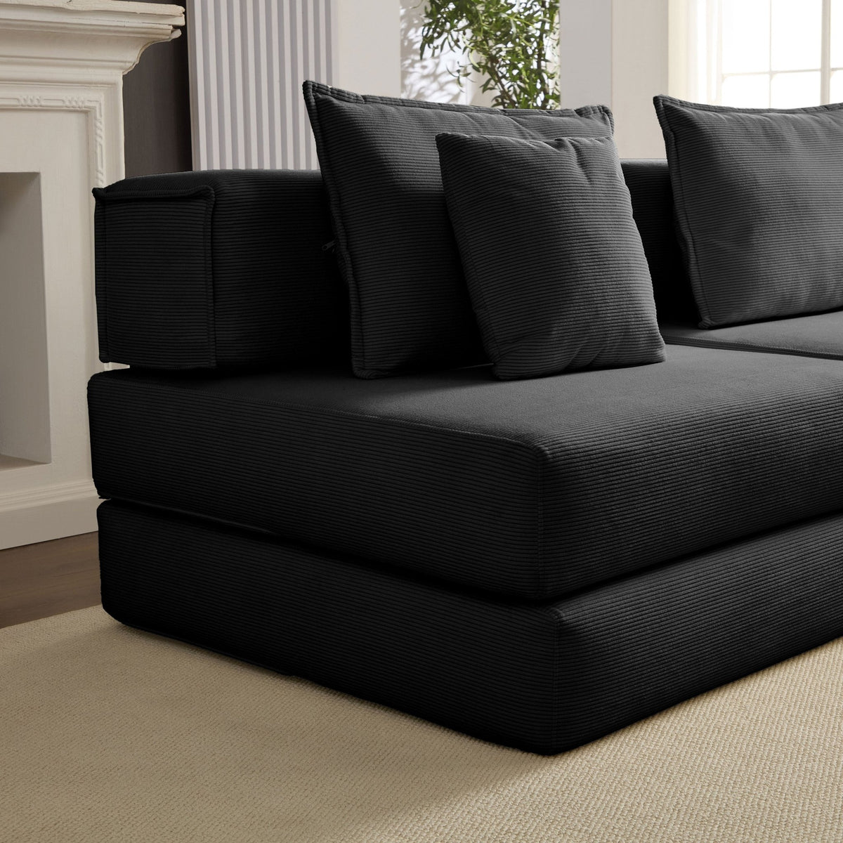 Black Anthony & Home corduroy modular sectional sofa with multiple seating sections and plush cushions.