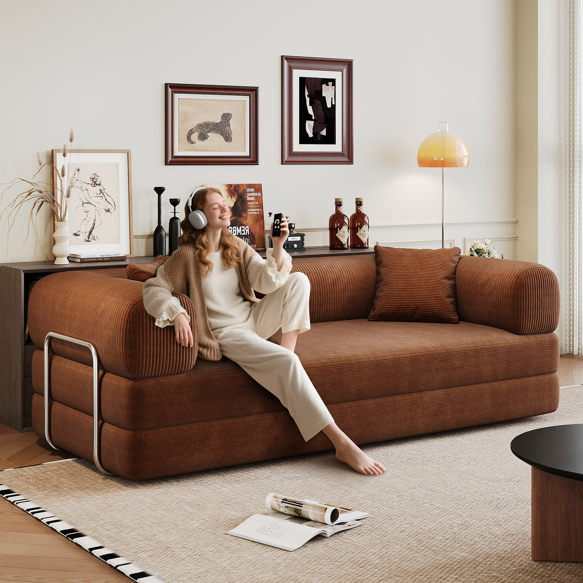 Corduroy Studio Convertible Sofa Bed by Anthony & Home showing the teal fabric, compact design, and convertible feature in a modern living space.