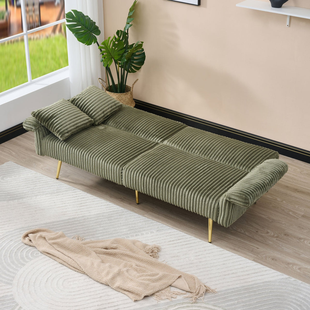 Emerald green corduroy velvet sofa bed by Anthony & Home, showcasing a modern design with plush upholstery and convertible sleeping area.