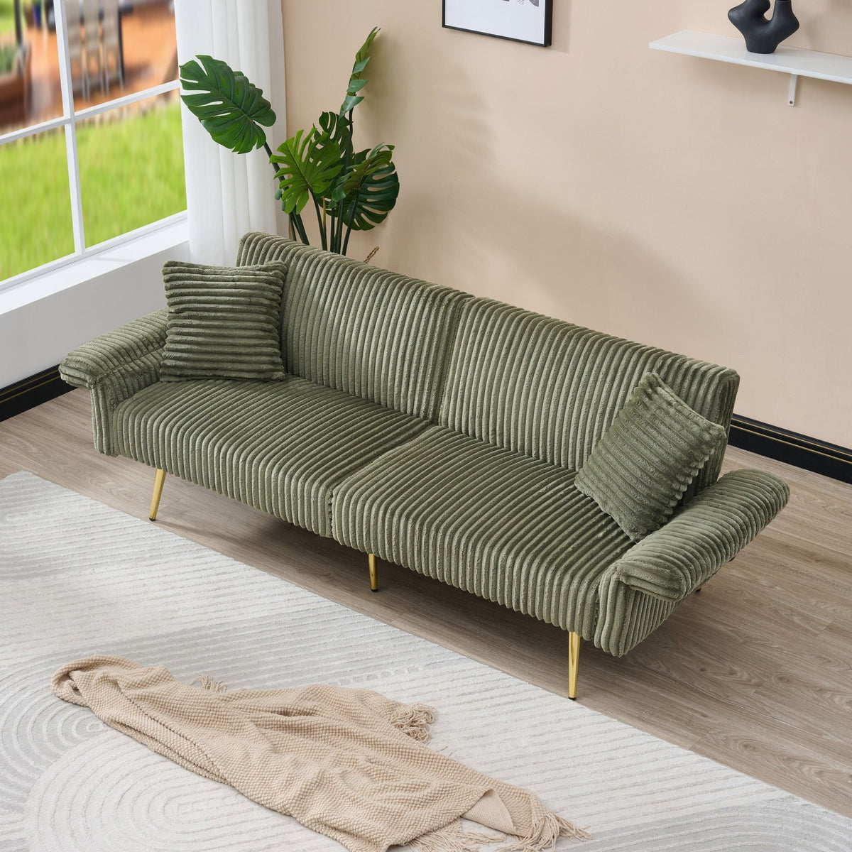 Emerald green corduroy velvet sofa bed with sleek design and plush cushions by Anthony & Home