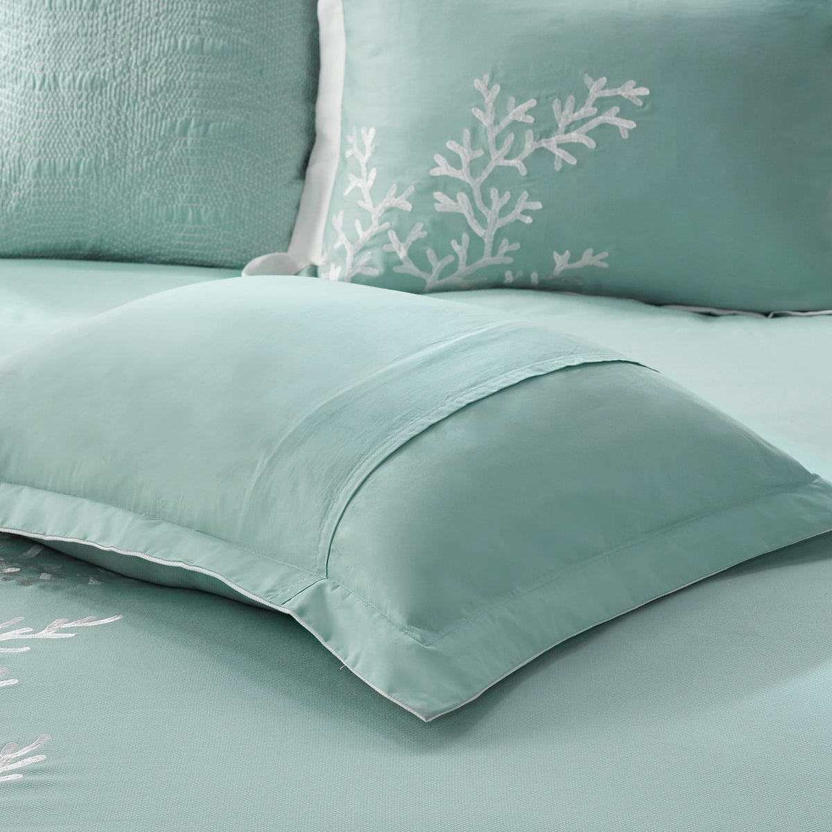 Queen-sized Anthony & Home cotton jacquard comforter set in aqua, showcasing intricate textured design and luxurious fabric.