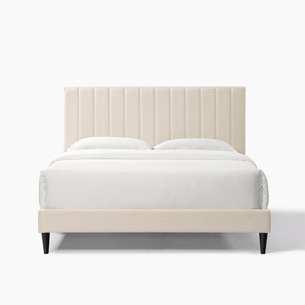 Cream boucle queen platform bed with midcentury tufted headboard, Anthony & Home, showcasing plush fabric and elegant design.