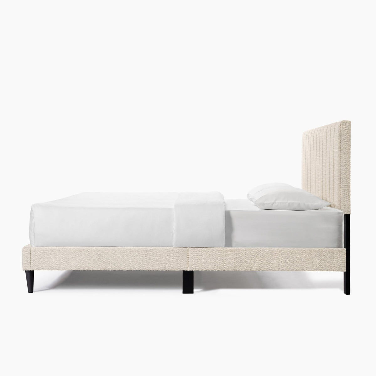Cream boucle Queen platform bed with tufted headboard, midcentury style from Anthony & Home, showcasing plush fabric and elegant design.