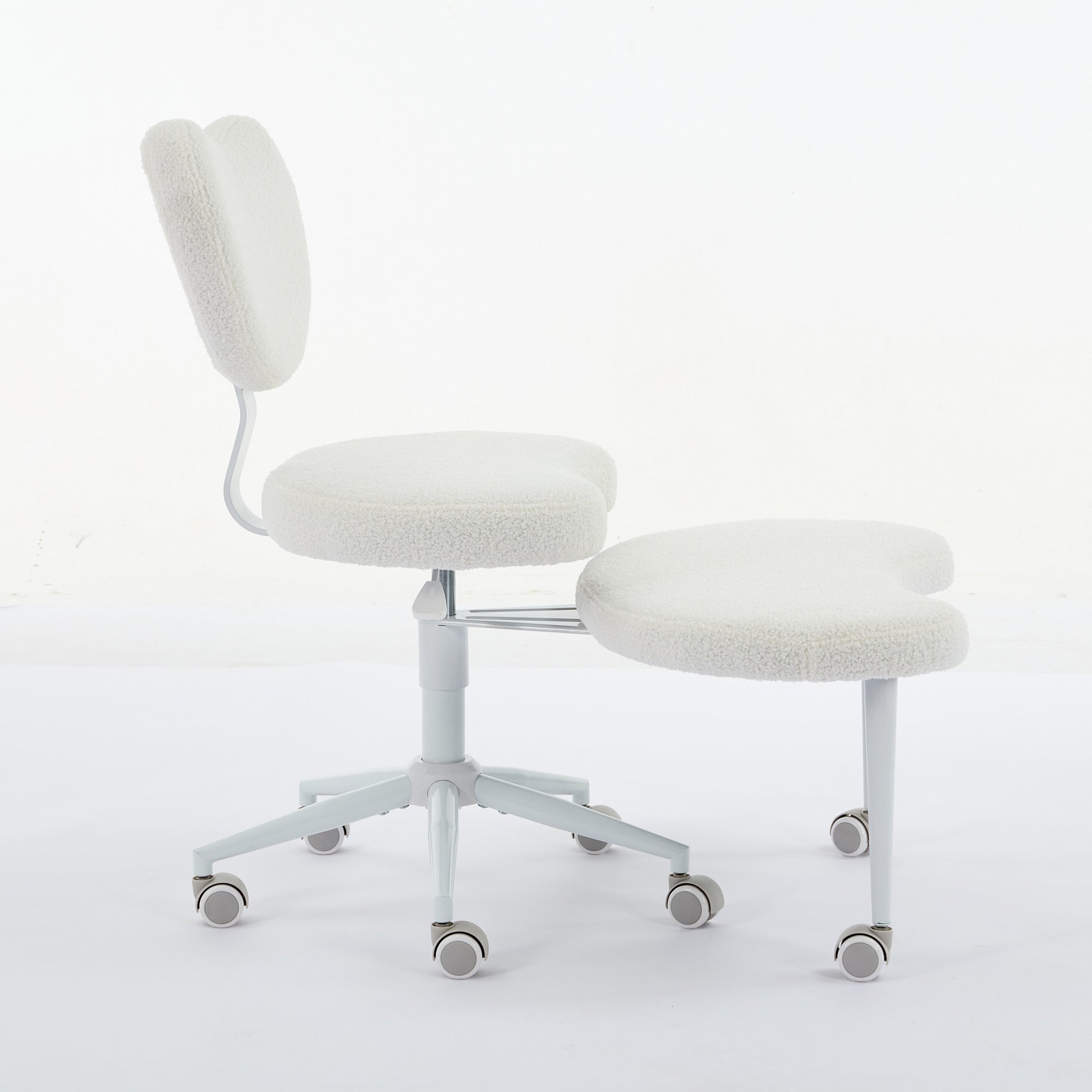 Ivory cross-legged meditation chair with wheels from Anthony & Home, featuring a comfortable padded seat and sturdy frame.