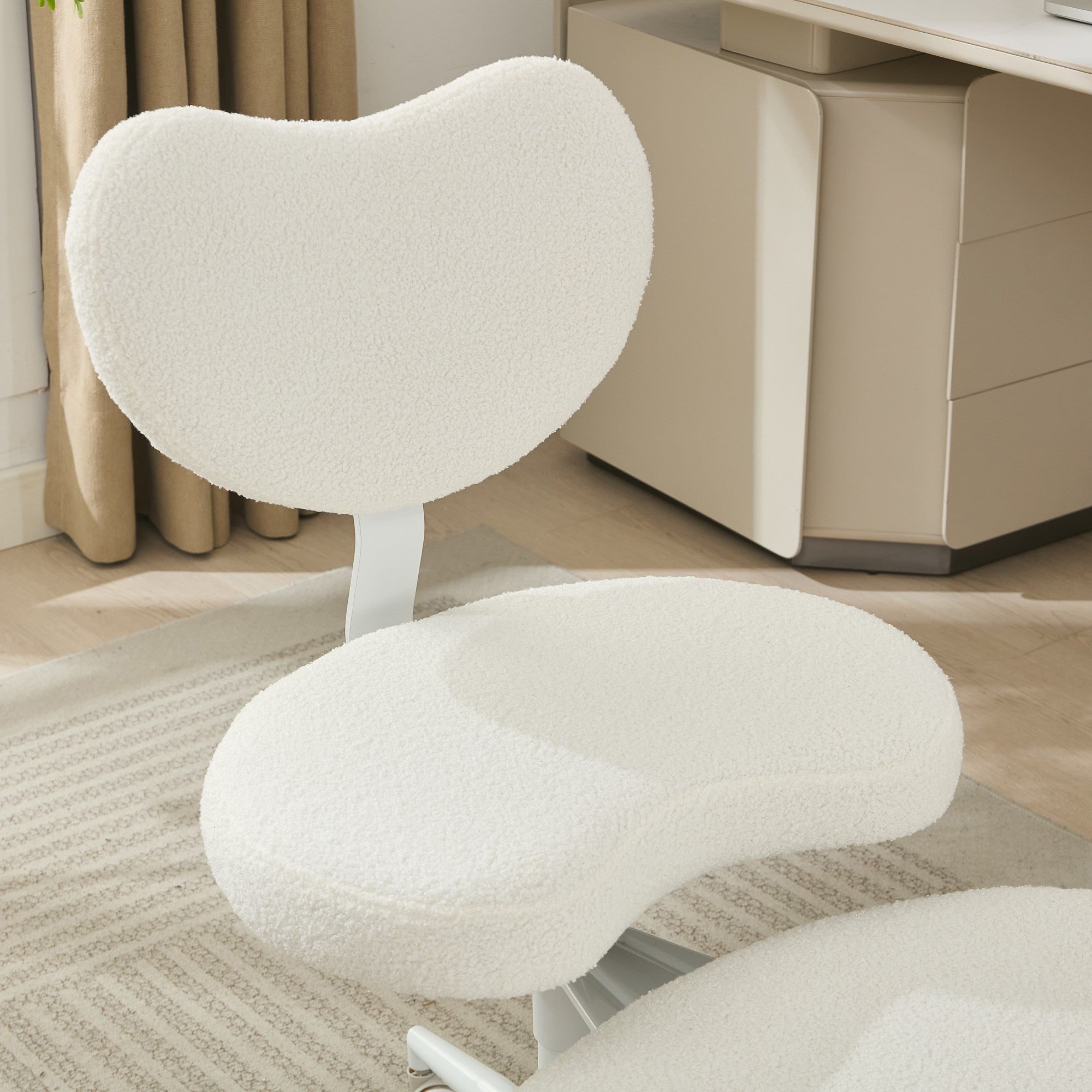 Ivory cross-legged meditation chair with wheels by Anthony & Home, designed for comfortable seated meditation.