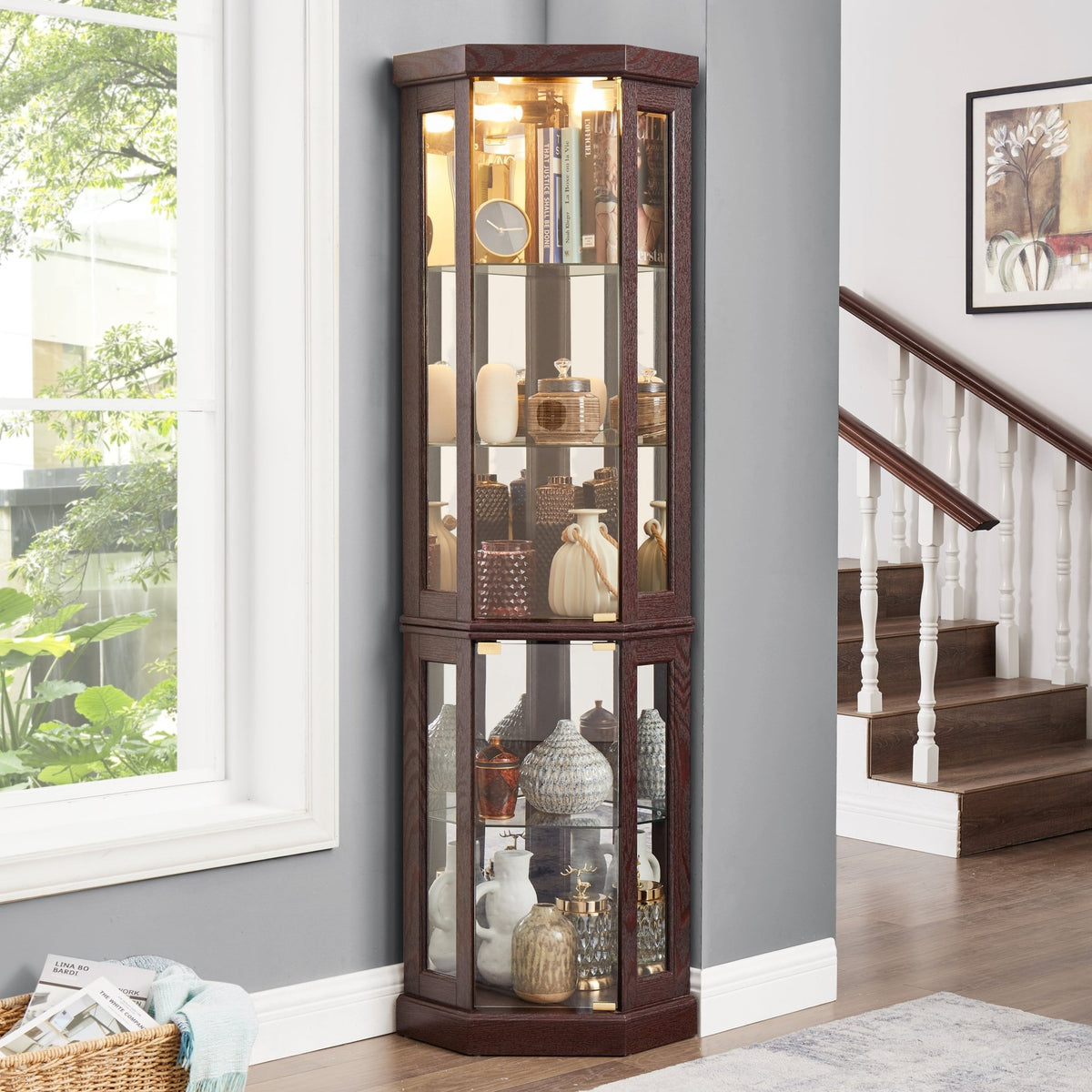 Dark cherry corner curio cabinet by Anthony & Home with glass doors and shelves for displaying collectibles.