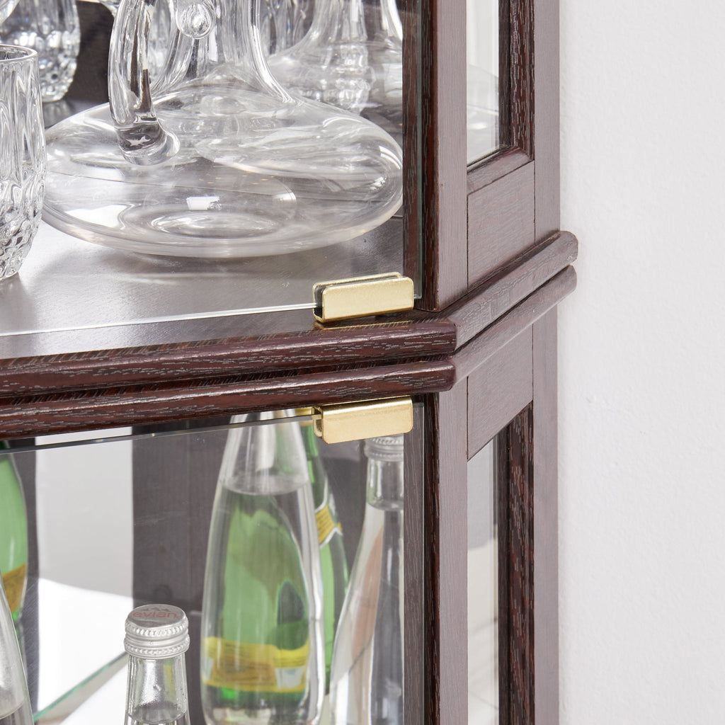 Dark cherry corner curio cabinet by Anthony & Home, showcasing glass display doors and elegant wood finish for living room decor.