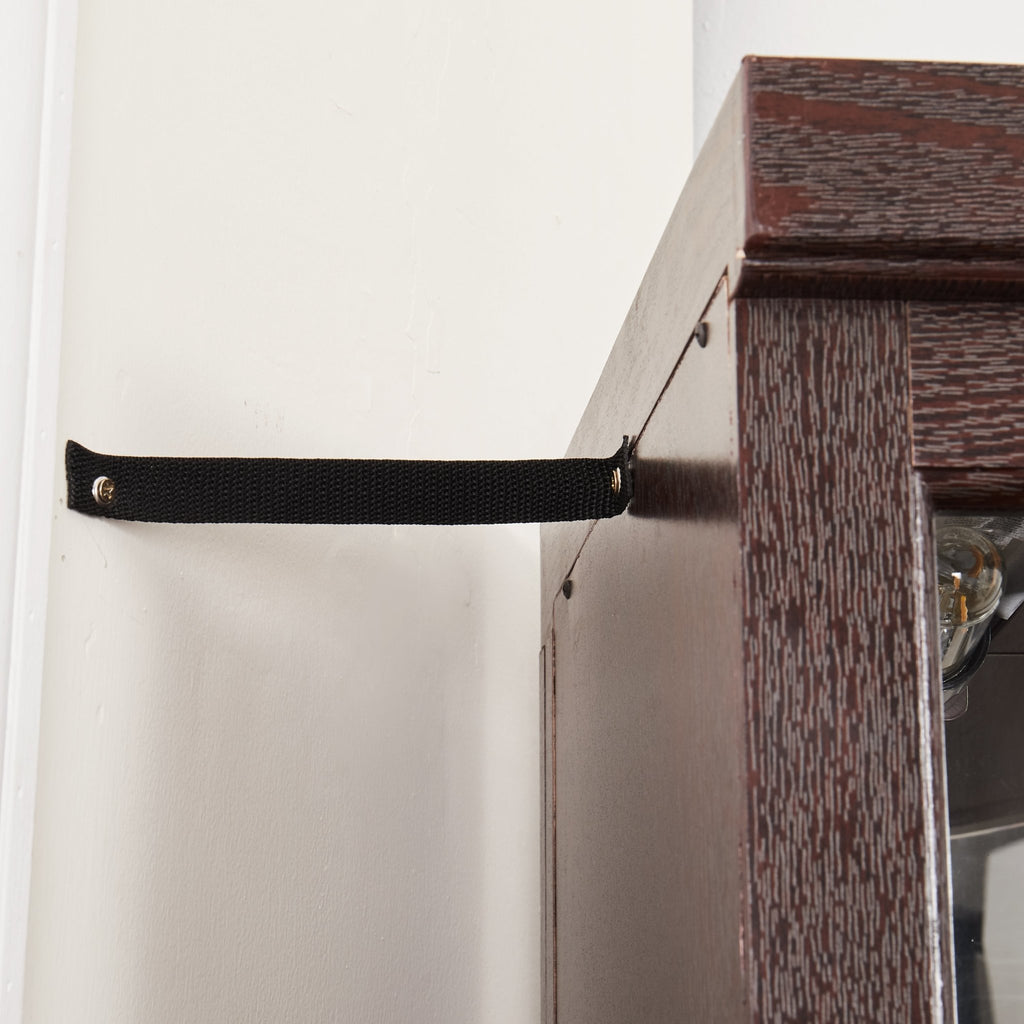 Dark cherry corner curio cabinet by Anthony & Home with glass doors and shelves for displaying collectibles.