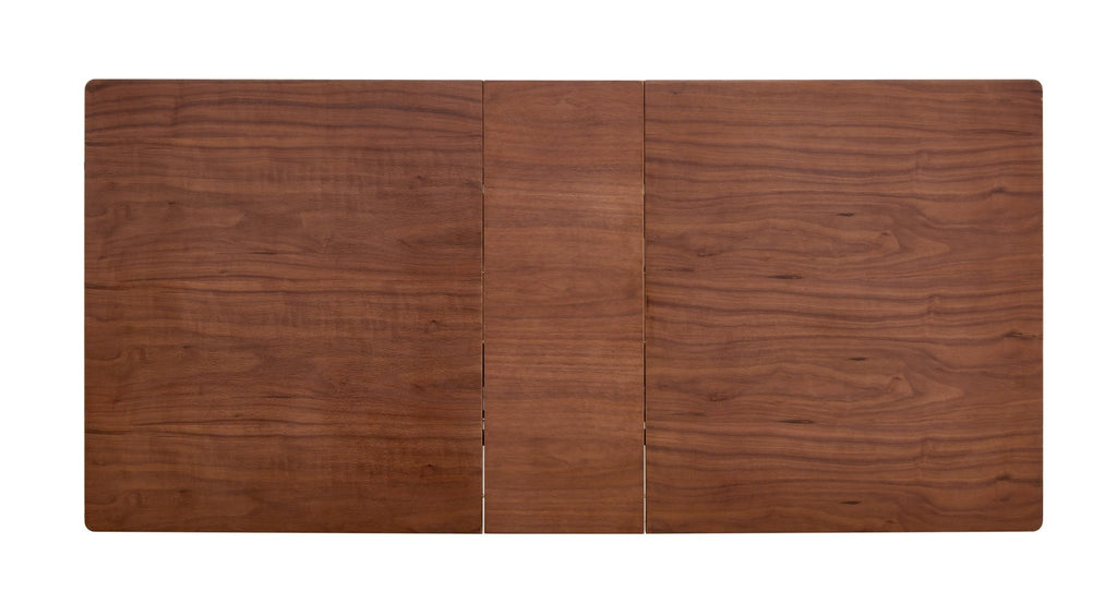 Dark walnut dining table with marble veneer top by Anthony & Home, showcasing a stylish and modern studio interior.