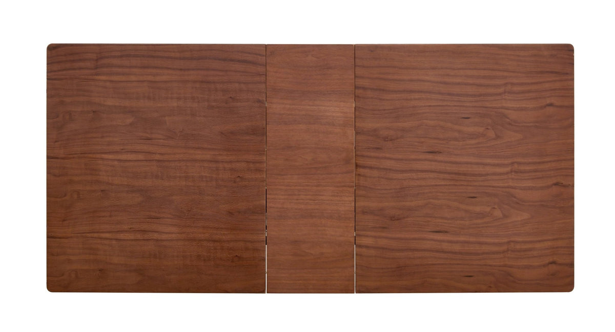 Dark walnut dining table with marble veneer top by Anthony & Home, showcasing a stylish and modern studio interior.