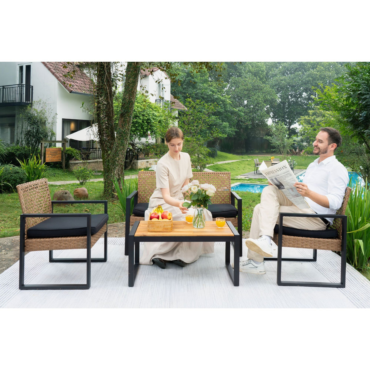 Outdoor 4-piece patio set by Anthony & Home with acacia wood table and handwoven PE rattan chairs.