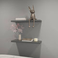 Matte grey floating shelf from Anthony & Home with sleek design and sturdy wall mount, perfect for modern interior decor.
