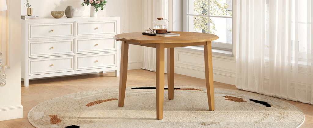 Extendable round dining table in solid wood by Anthony & Home, showcasing a natural wood finish and sturdy design.