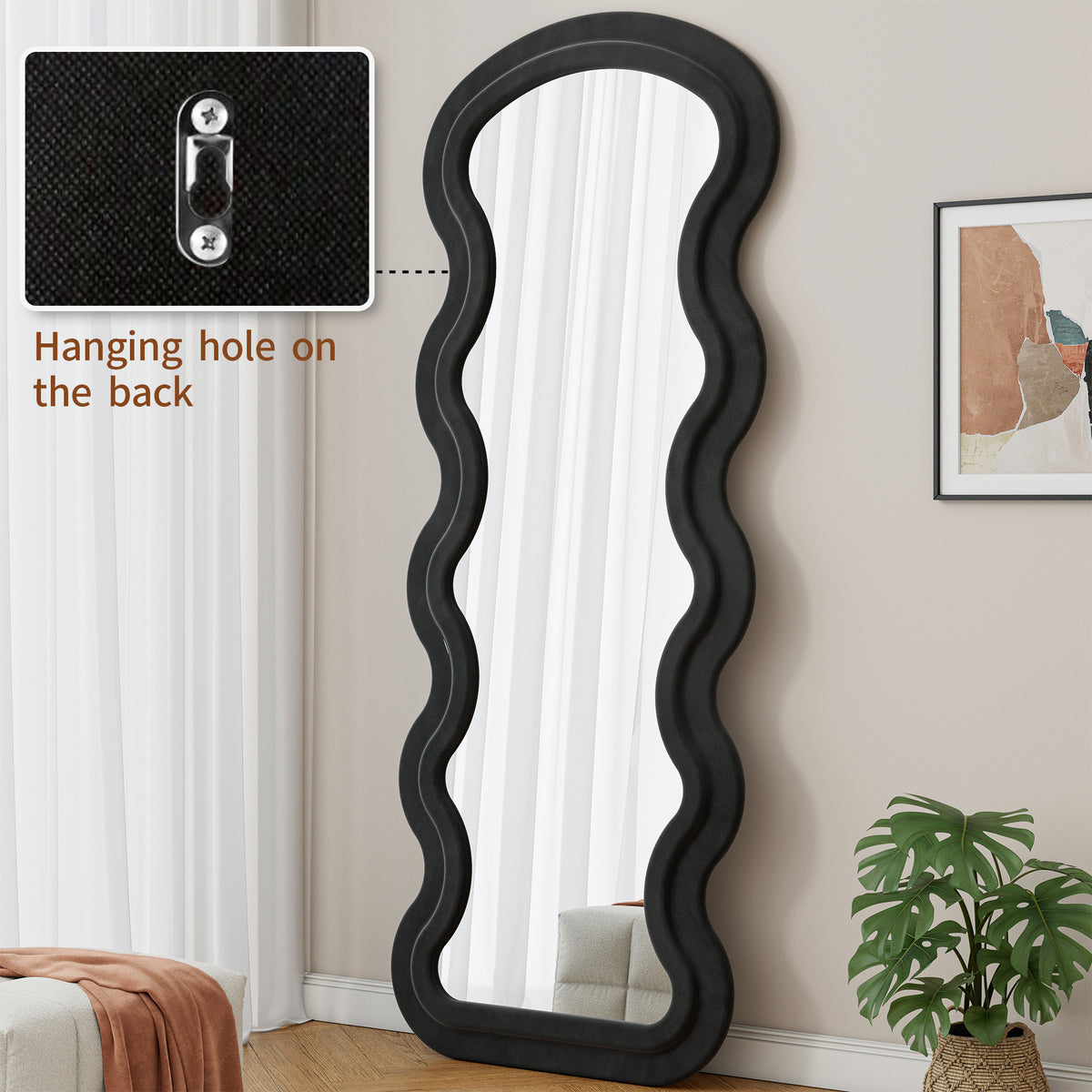 Black Flannel Wave Floor Mirror from Anthony & Home Studio Edition, showcasing a modern, curved design and reflective glass surface.