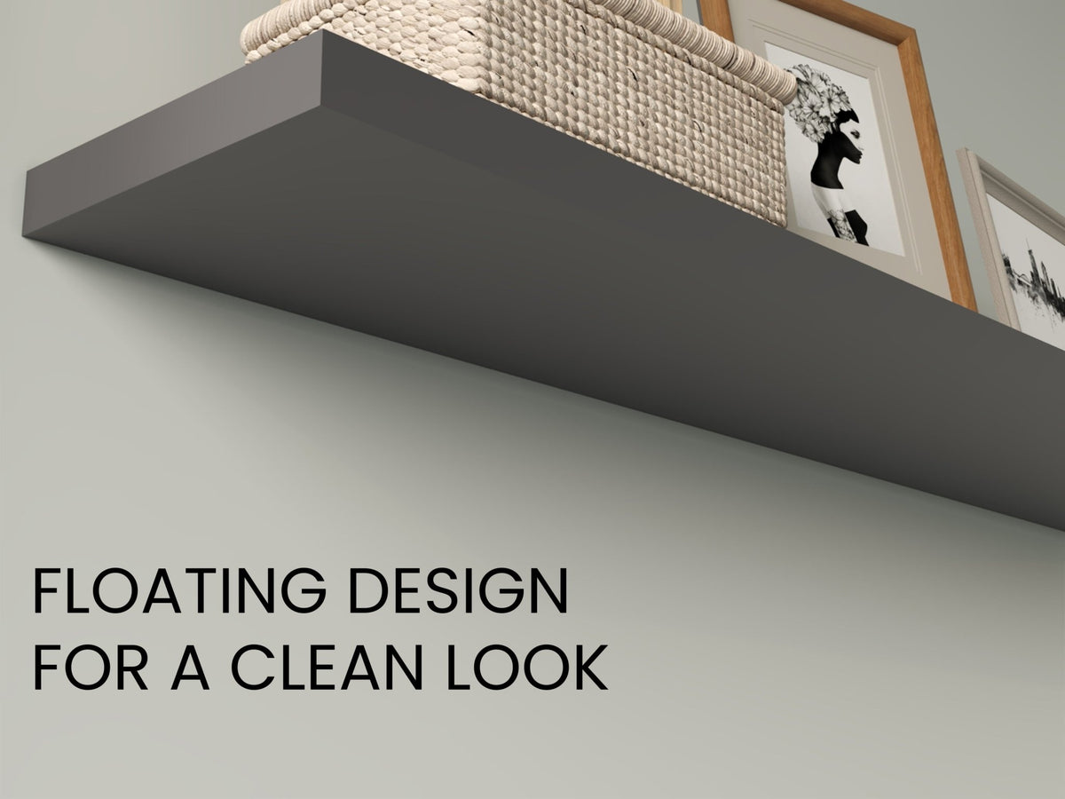 Two matte gray floating shelves from Anthony & Home's collection, mounted on a wall with decorative items displayed.