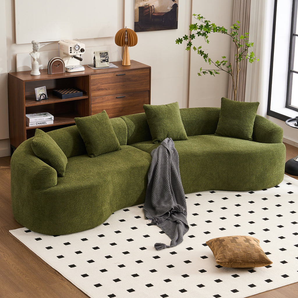 Forest green Atelier curved modular sectional sofa by Anthony & Home, featuring plush cushions and modern design.