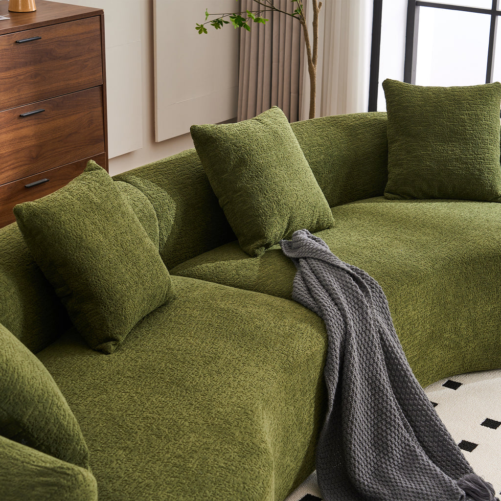 Forest green Atelier curved modular sectional sofa by Anthony & Home, shown with plush cushions and modern design.