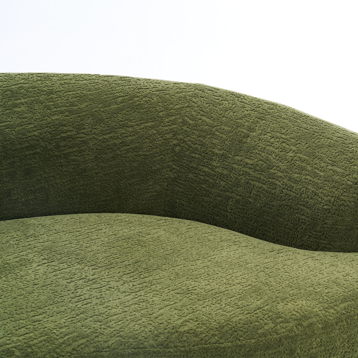 Forest green Anthony & Home Atelier curved sectional sofa with modular design, featuring plush cushions and sleek modern style.