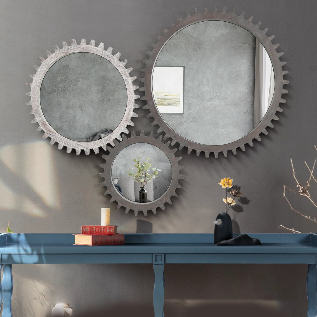Antique white washed wood round mirror with a gear-inspired frame, ideal for studio or vintage decor by Anthony & Home