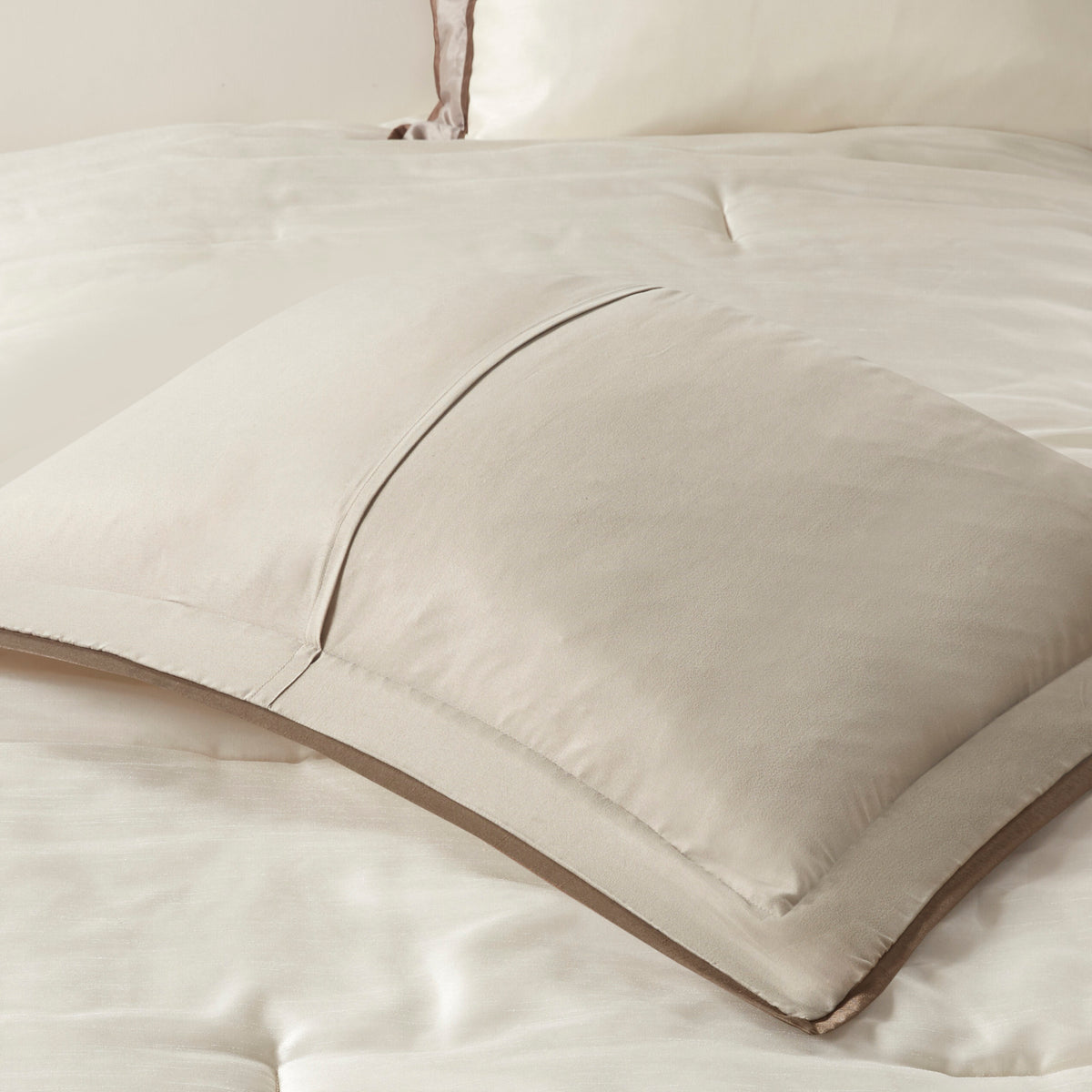 Genevieve Polyoni taupe king comforter set by Anthony & Home with plush fabric and decorative pillows on a bed.