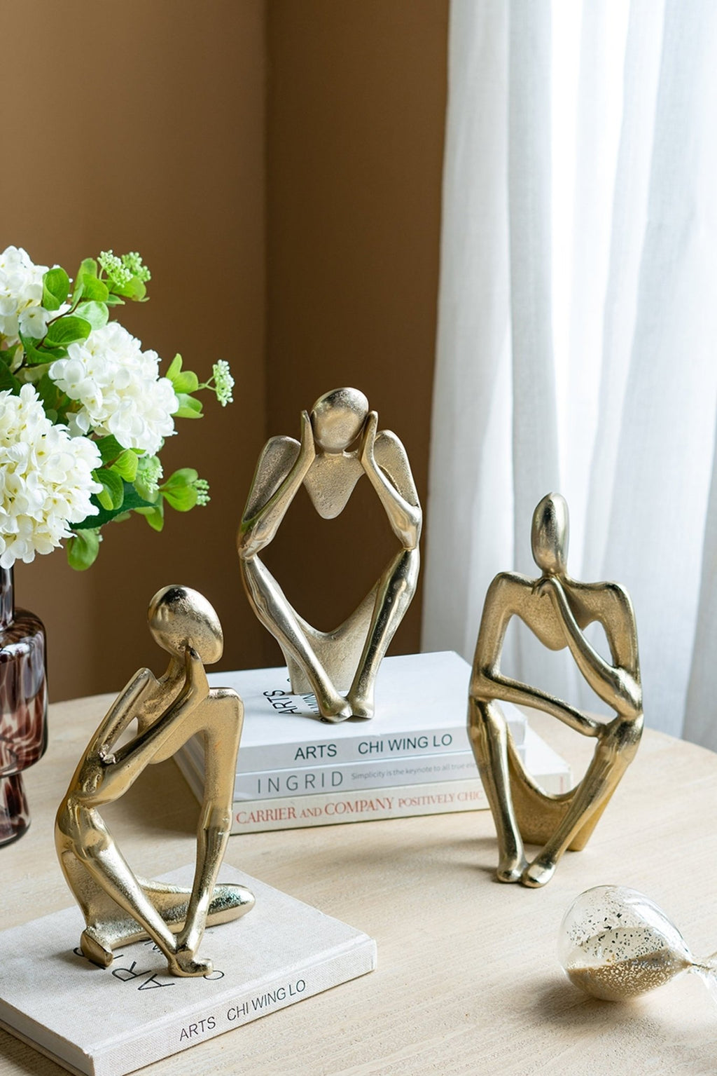 Gold aluminum abstract figurine by Anthony & Home, limited studio edition, featuring sleek modern sculpture with smooth curves.
