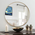 Round 24-inch gold metal bathroom mirror with sleek frame, designed for modern bathroom decor by Anthony & Home.