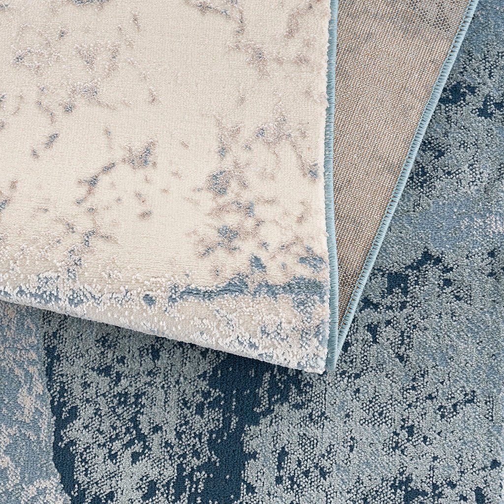 Anthony & Home Grace Abstract Wave area rug with machine-woven polyester cut-and-loop pile in limited edition design.