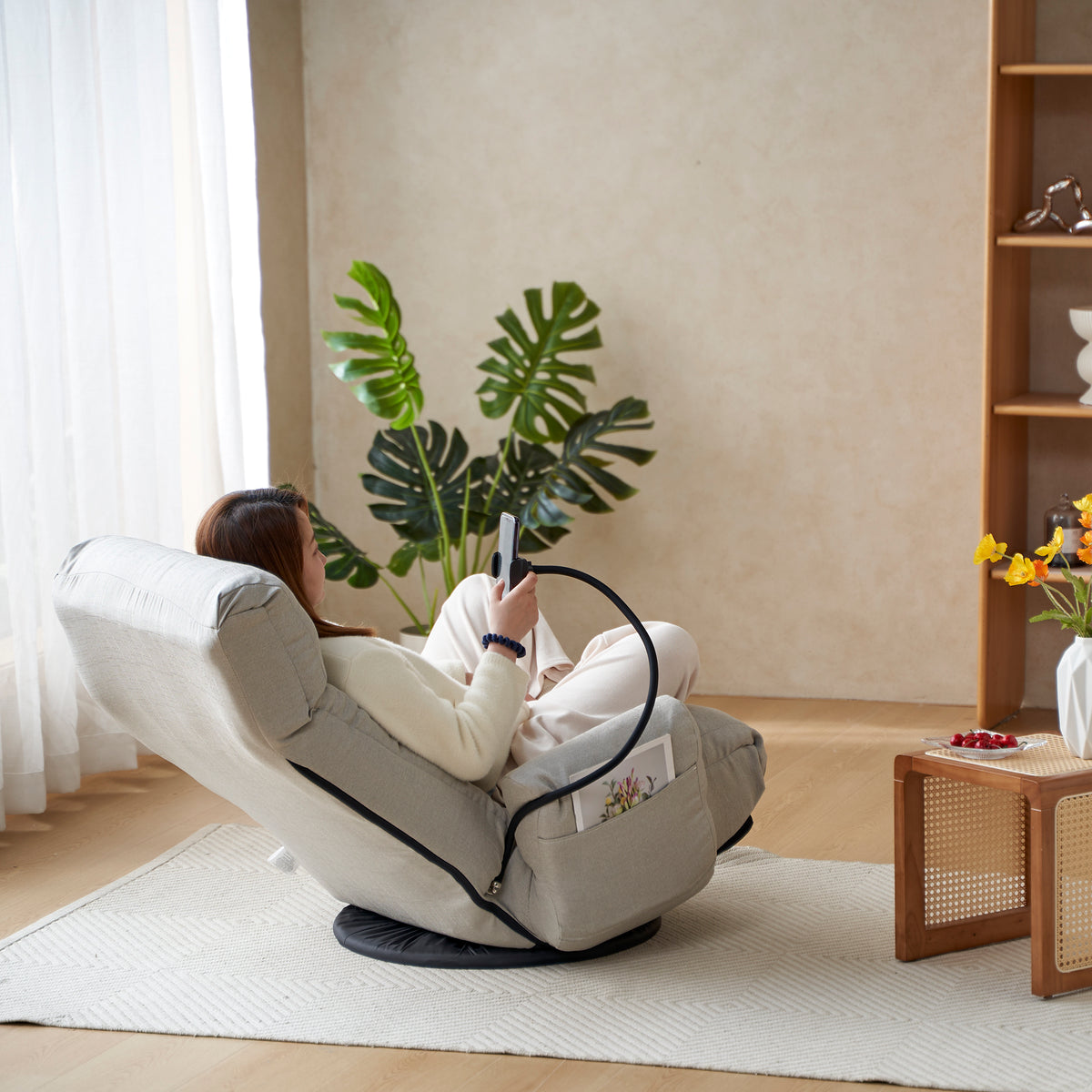 Gray Anthony & Home swivel lounge chair with 360-degree rotation, featuring a modern design and comfortable cushioned seating.