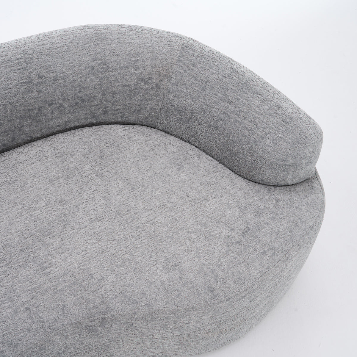 Grey curved modular sofa by Anthony & Home in soft chenille fabric, showcasing its luxurious, contemporary design.