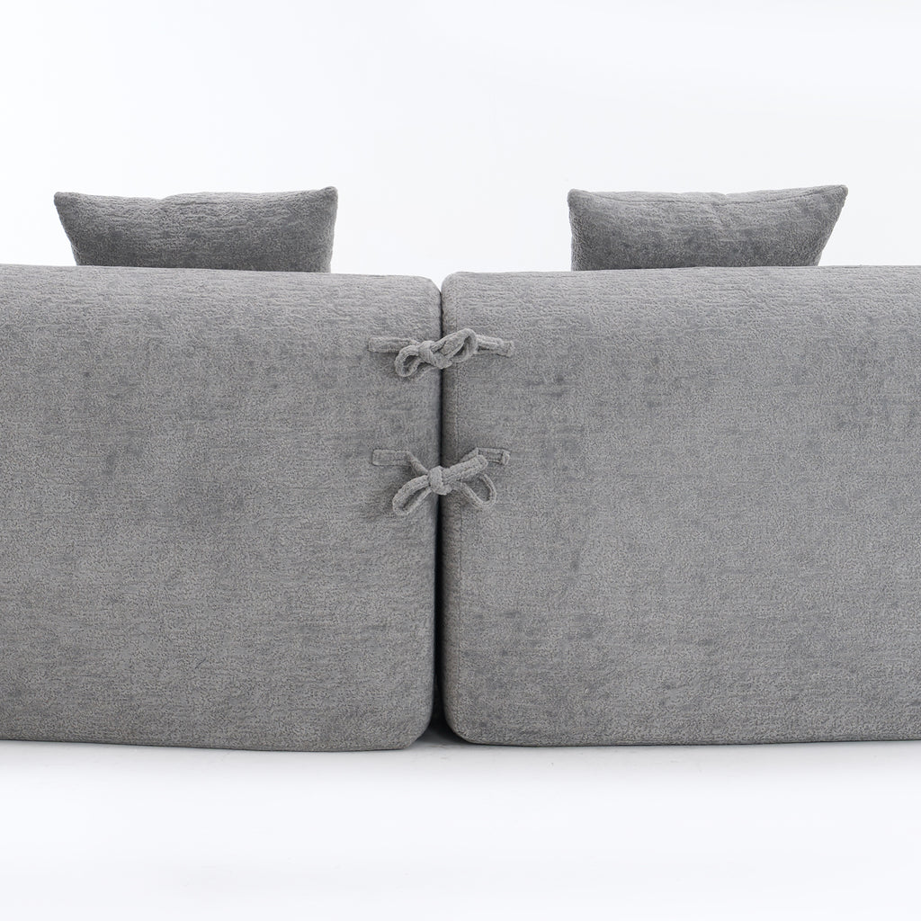Grey curved modular sofa in chenille fabric from Anthony & Home, showcasing a modern, plush sectional with comfortable cushions.