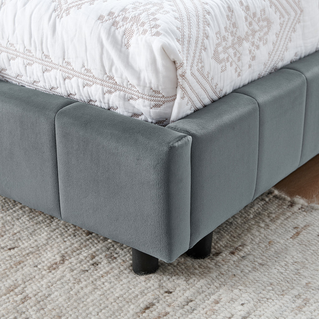 Grey velvet tufted full-size bed frame with a padded headboard and elegant design, by Anthony & Home.