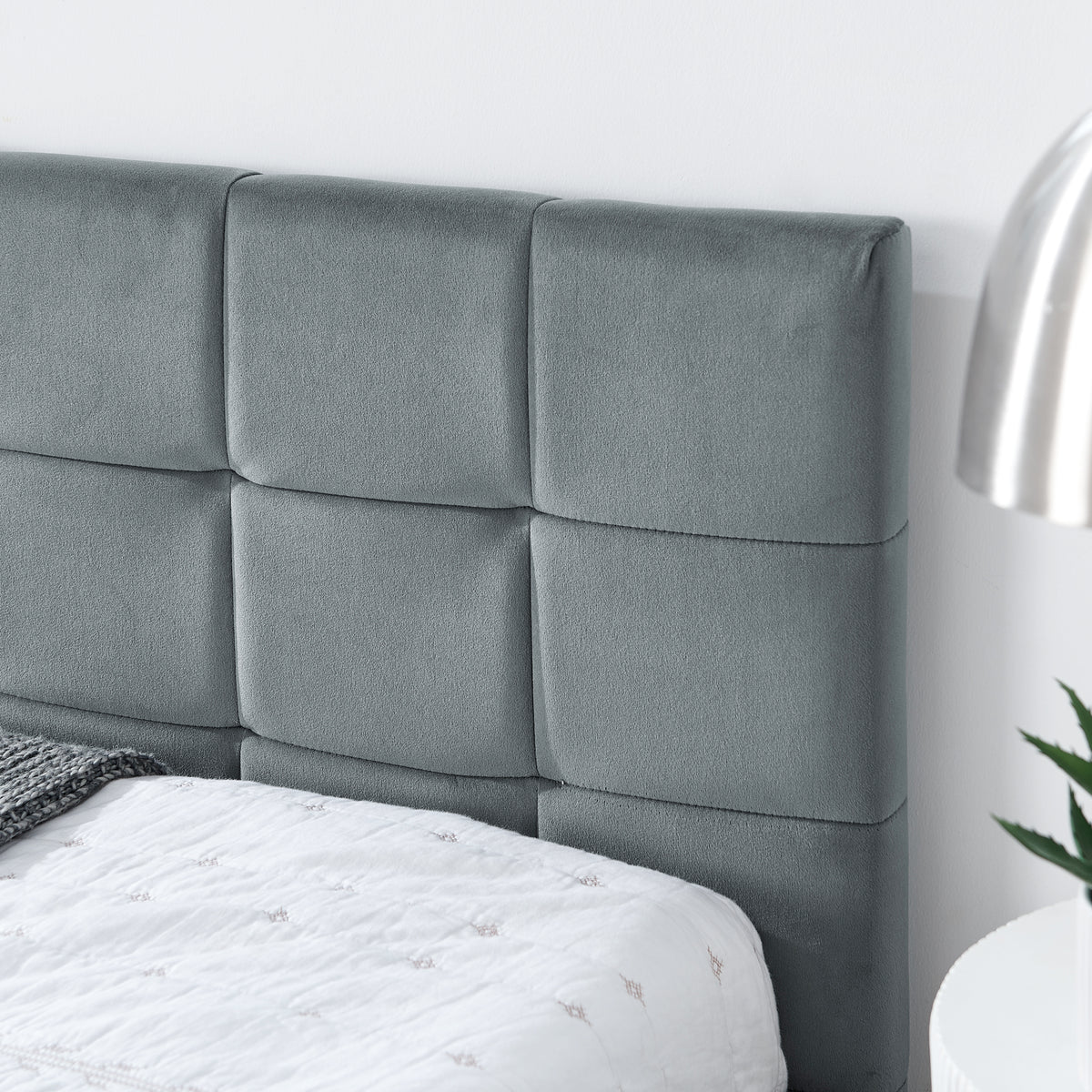 Grey velvet tufted full-size bed frame with a limited edition design by Anthony & Home, featuring a plush, upholstered headboard.