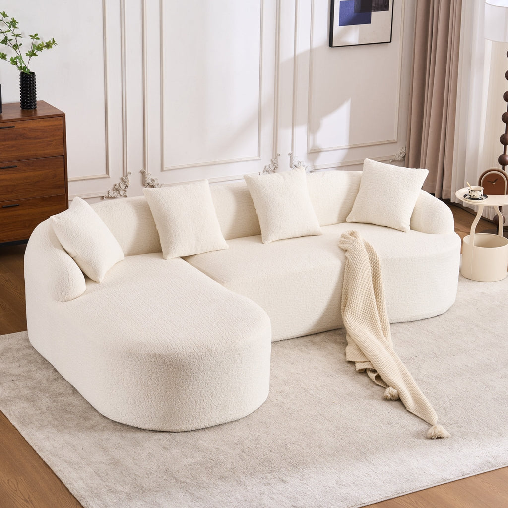 Anthony & Home Heritage Collection L-shaped sectional with curved chaise, showcasing elegant minimalist design and plush upholstery.