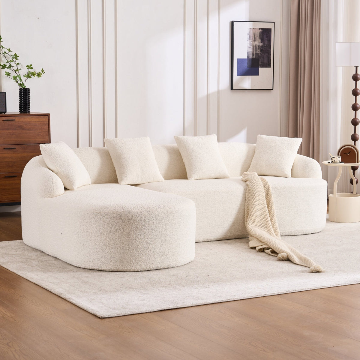 Anthony & Home Heritage Collection L-shaped sectional with curved chaise in elegant minimalist design, showcasing plush cushioning and modern style.
