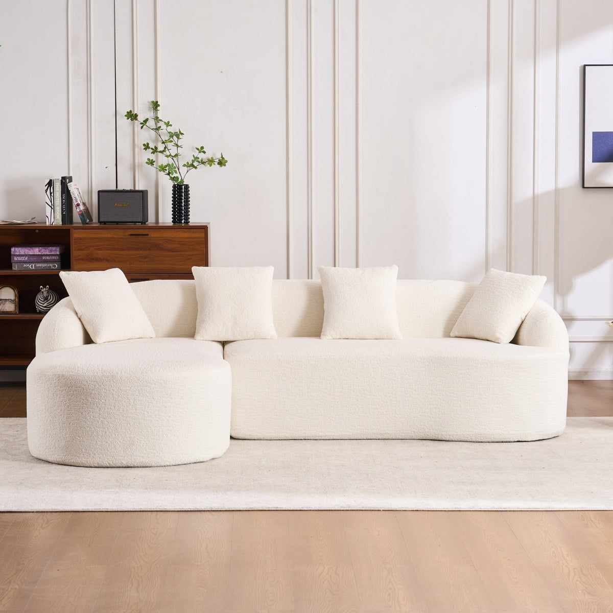 Elegant Anthony & Home Heritage Collection L-shaped sectional with curved chaise in minimalist design, showcasing modern comfort.
