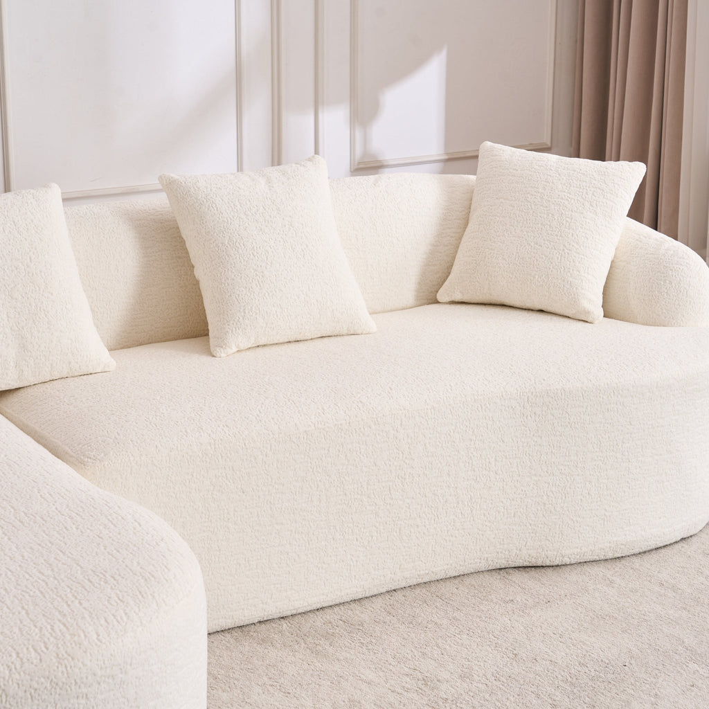 Anthony & Home Heritage Collection L-shaped sectional with curved chaise in elegant minimalist design, shown in a modern living room setting.