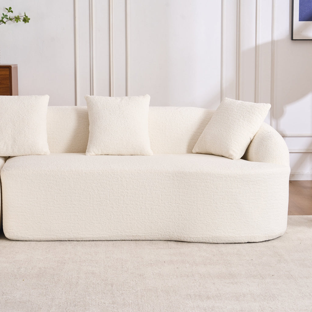 Anthony & Home Heritage Collection L-shaped sectional sofa with curved chaise, elegant minimalist design in neutral fabric.