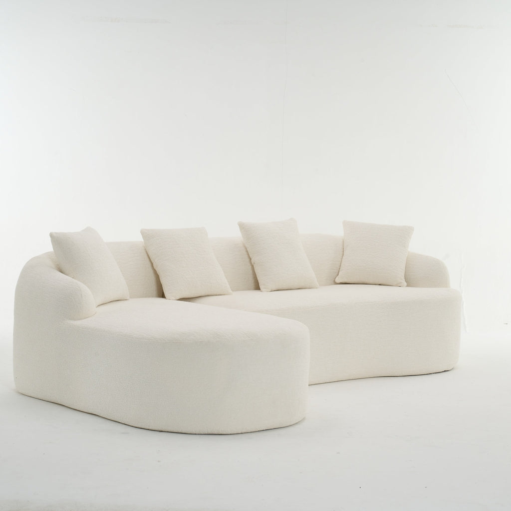 Anthony & Home Heritage Collection L-shaped sectional sofa with curved chaise in elegant minimalist design, shown from a side view.